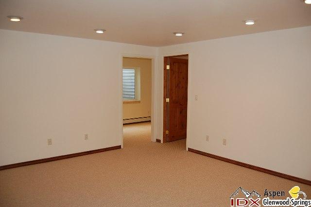 1056 Village Road Carbondale, CO 81623 - Photo 5 of 9 an empty room with a natural light