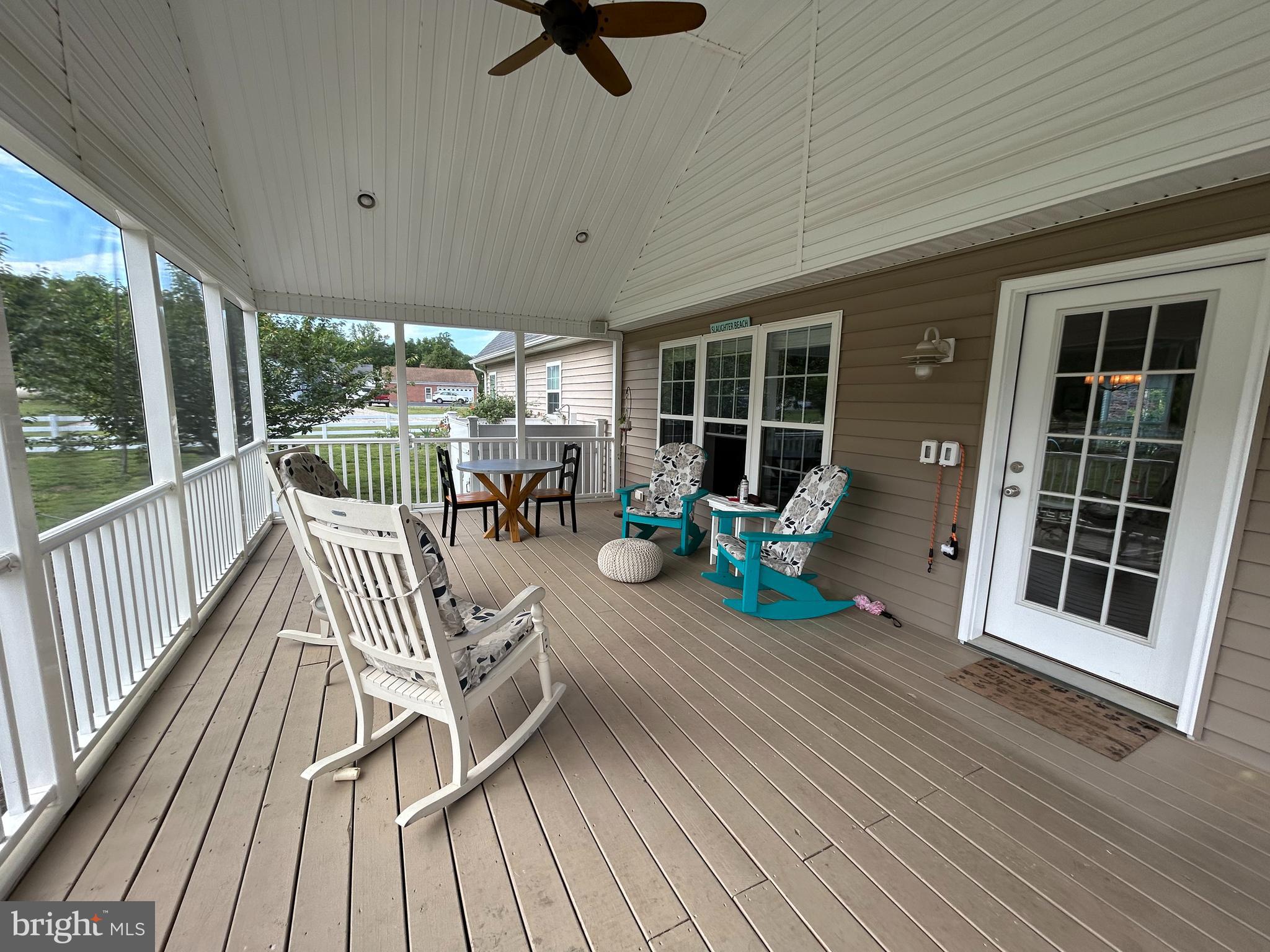 20346 Cool Spring Road Milton, DE 19968 - Photo 17 of 69 a view of a patio with couches table and chairs and wooden floor