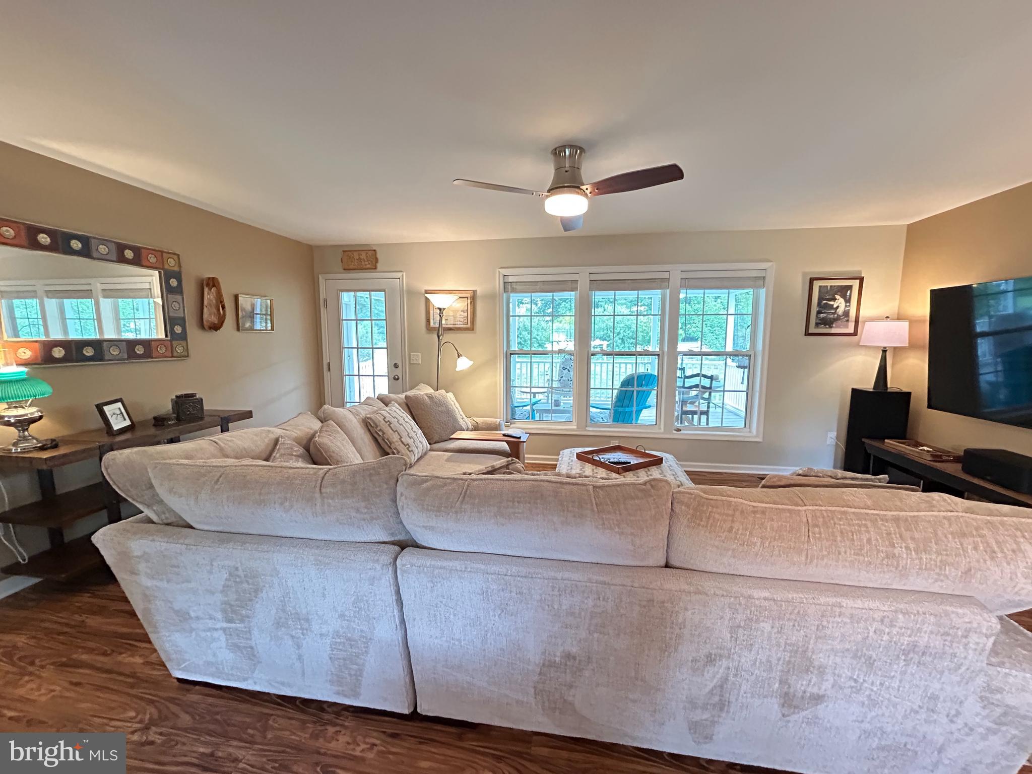 20346 Cool Spring Road Milton, DE 19968 - Photo 20 of 69 a living room with furniture and a flat screen tv