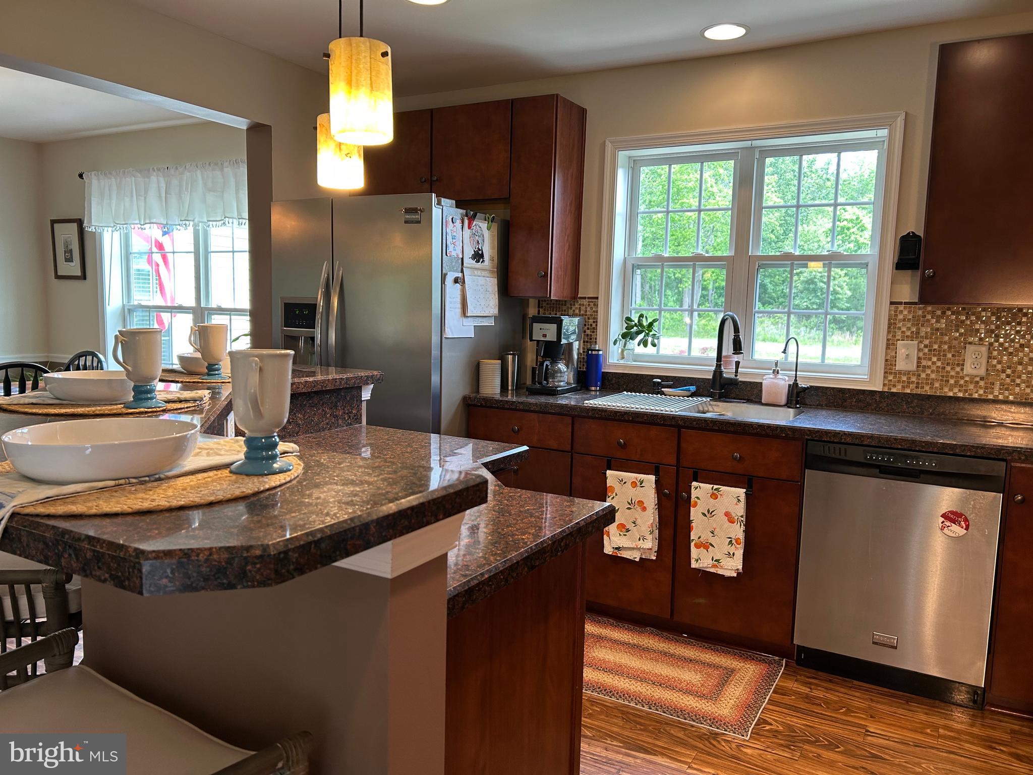 20346 Cool Spring Road Milton, DE 19968 - Photo 30 of 69 a kitchen with counter space sink and refrigerator
