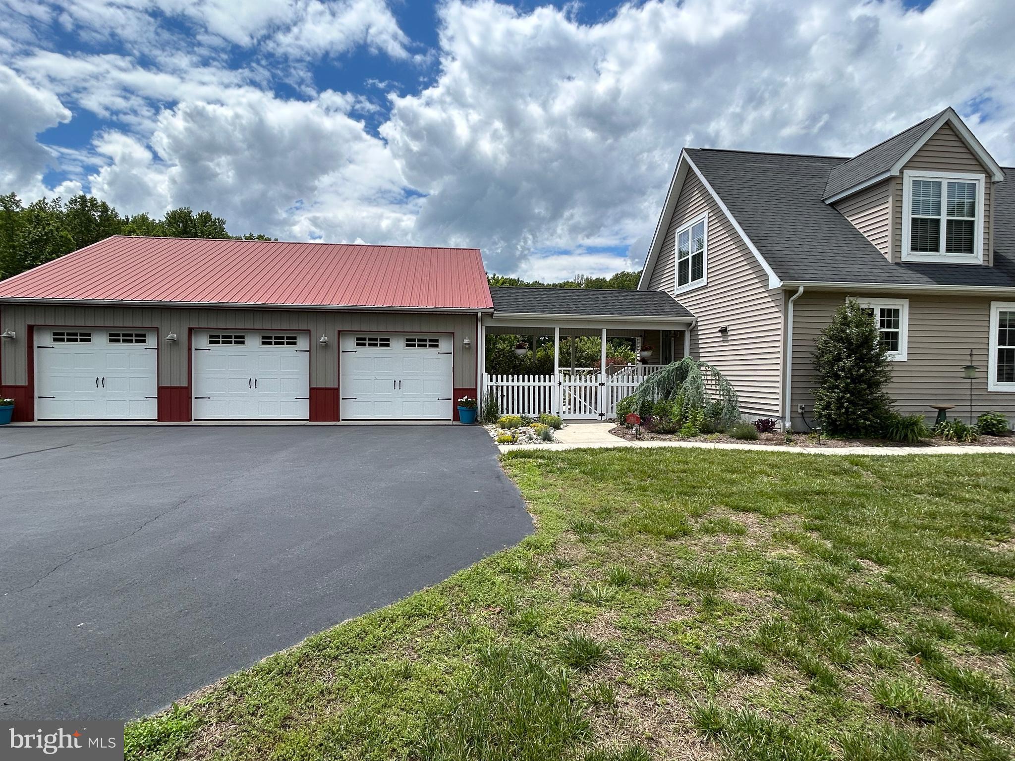 20346 Cool Spring Road Milton, DE 19968 - Photo 3 of 69 a view of a house with a yard plants and large tree