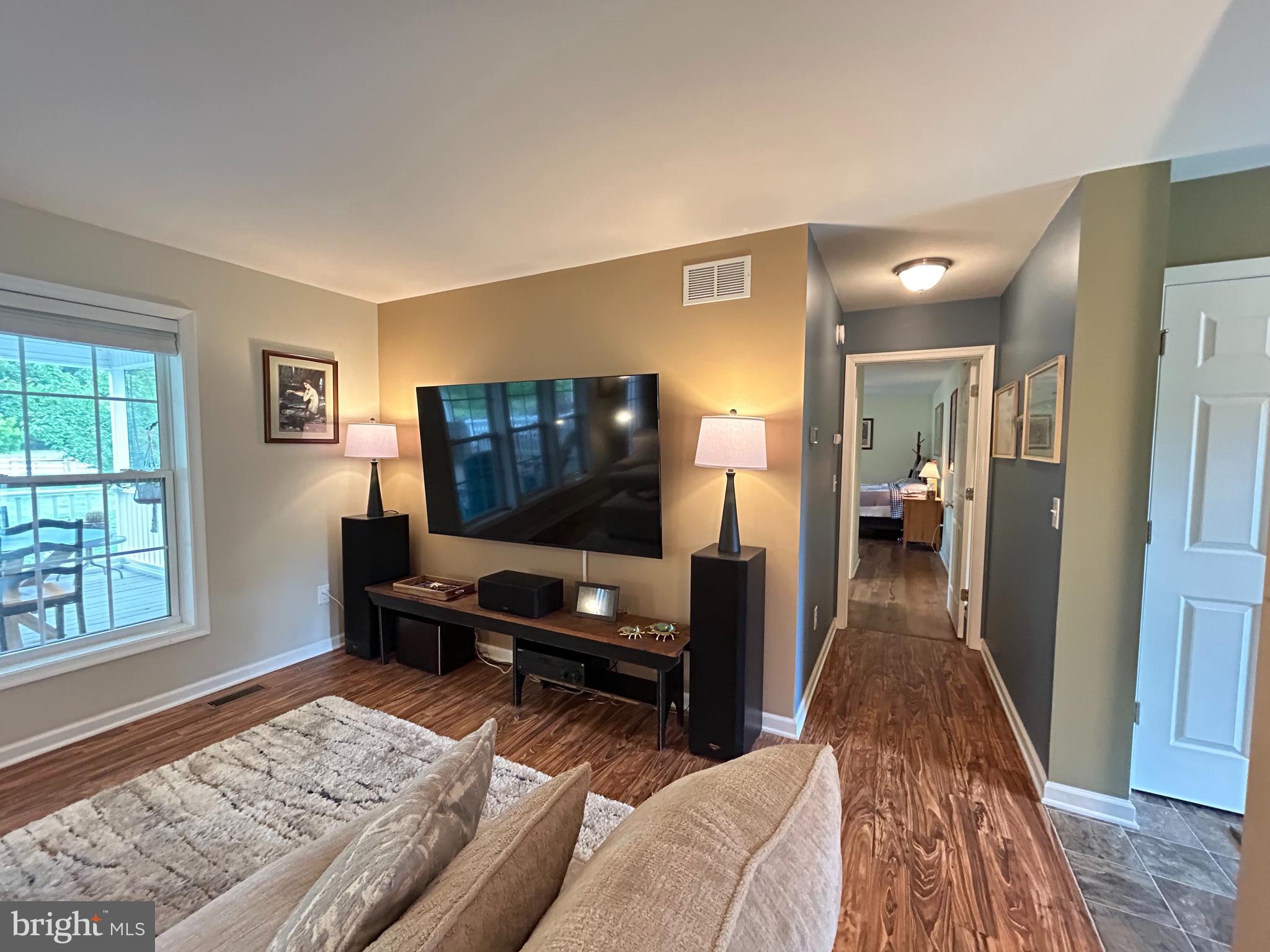 20346 Cool Spring Road Milton, DE 19968 - Photo 36 of 69 a living room with furniture and a flat screen tv