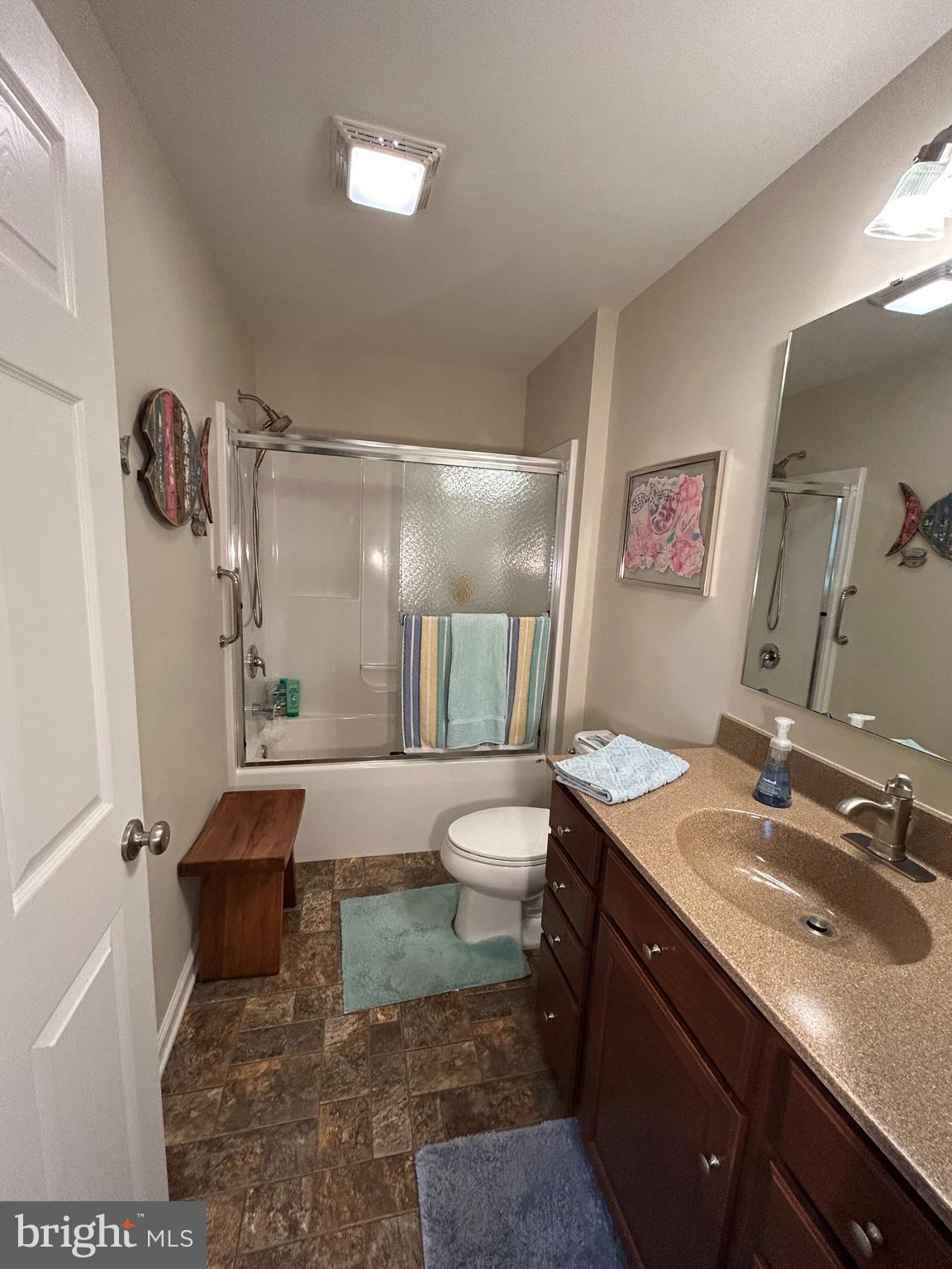 20346 Cool Spring Road Milton, DE 19968 - Photo 50 of 69 a bathroom with a granite countertop sink toilet and shower