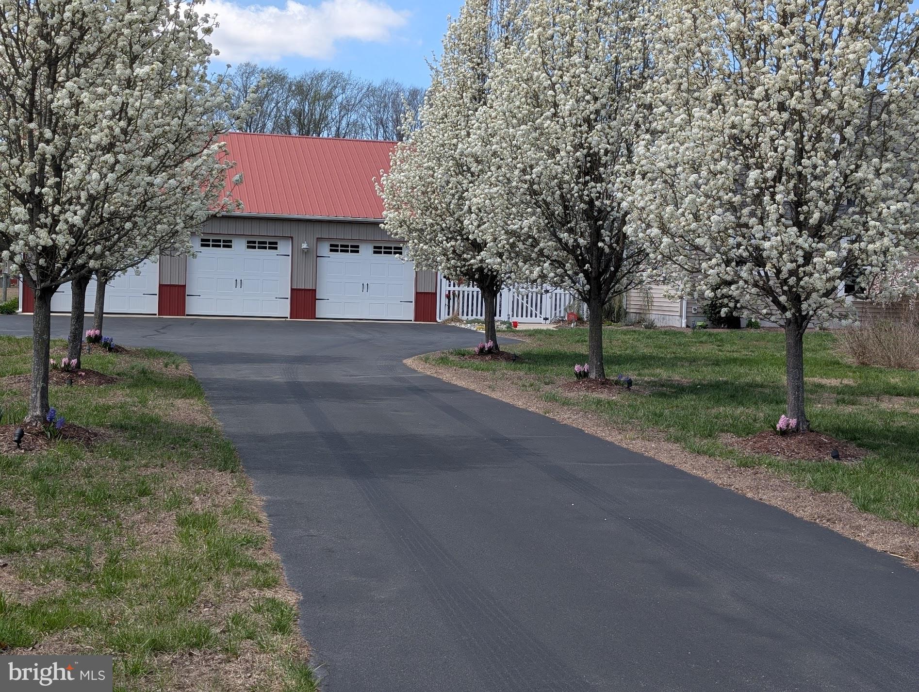 20346 Cool Spring Road Milton, DE 19968 - Photo 67 of 69 a front view of a house with a yard and garage
