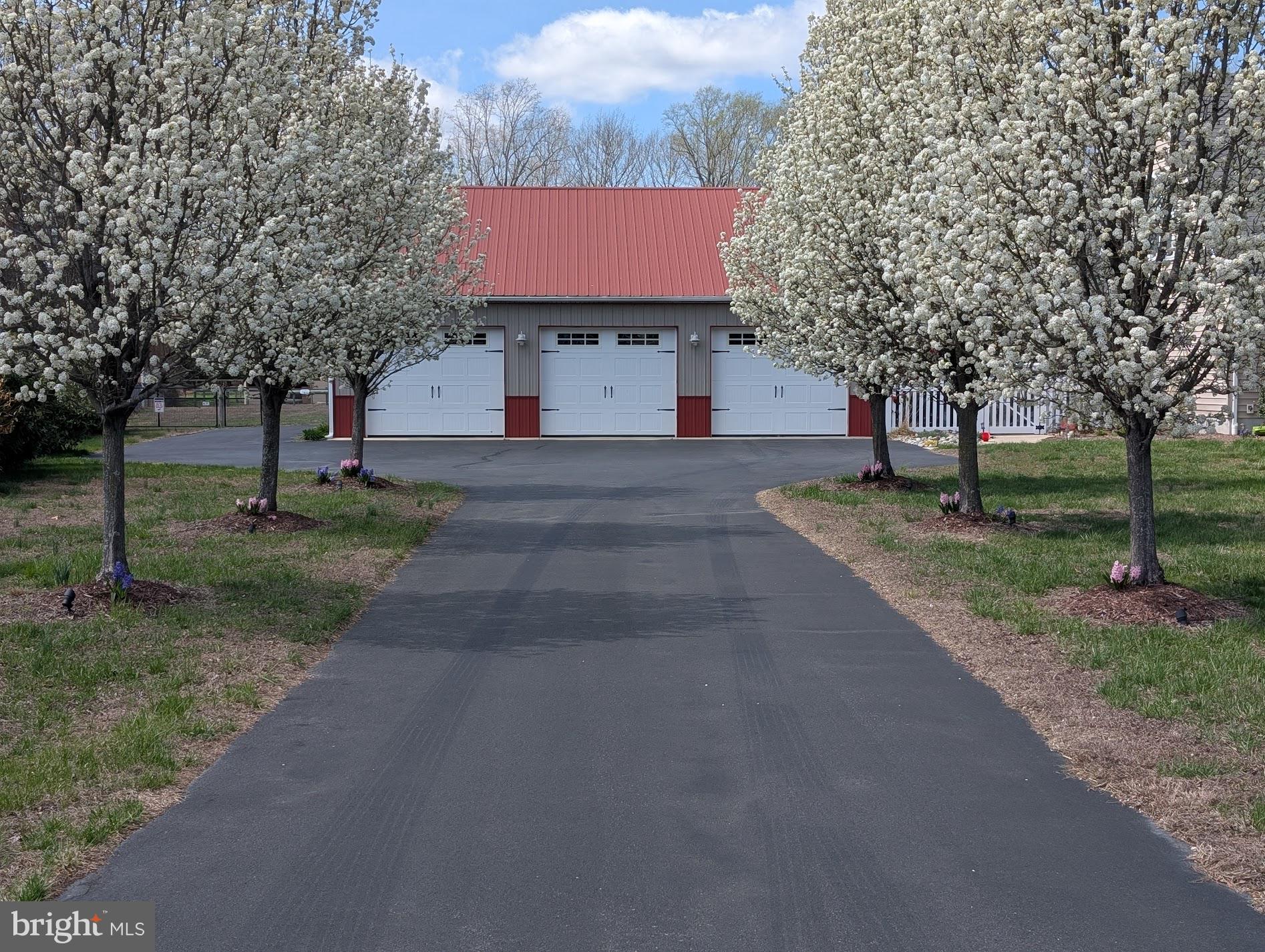 20346 Cool Spring Road Milton, DE 19968 - Photo 69 of 69 a front view of a house with a yard and garage