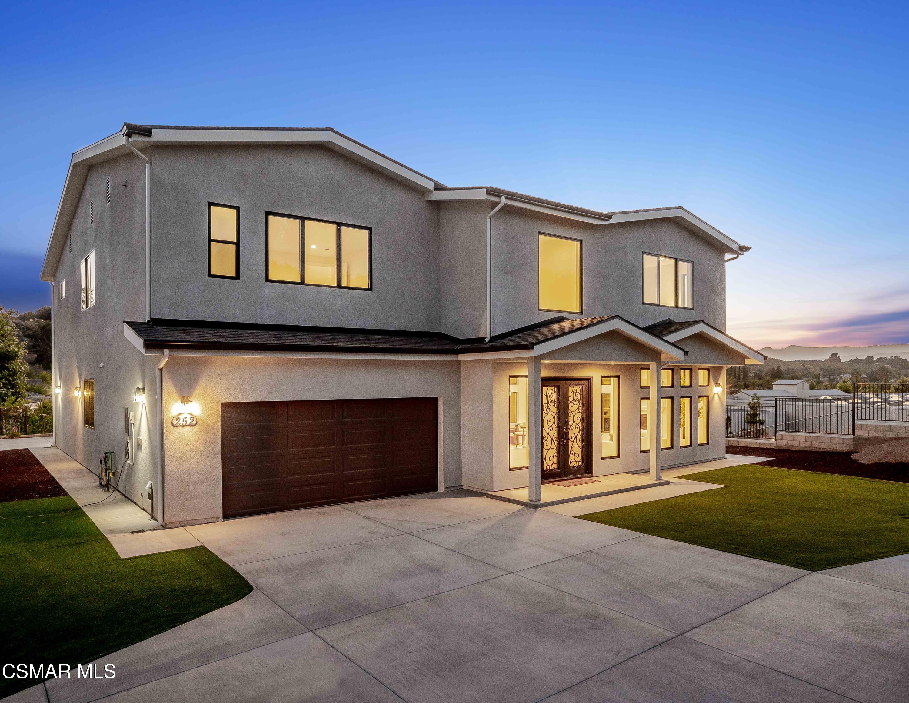 252 Capri Drive Simi Valley, CA 93065 - Photo 7 of 15 a front view of a house with a yard and garage