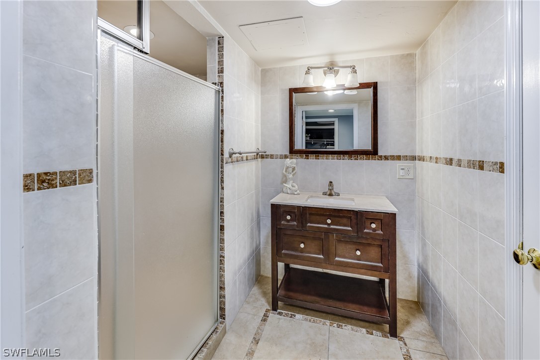 2885 Triggerfish Street Cape Coral, FL 33993 - Photo 13 of 35 a bathroom with a sink and a mirror