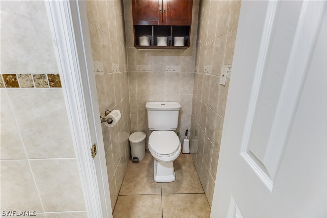 2885 Triggerfish Street Cape Coral, FL 33993 - Photo 14 of 35 a bathroom with a toilet and a shower