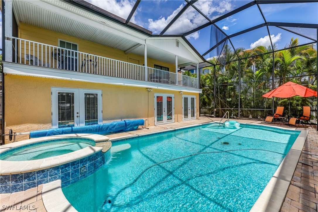 2885 Triggerfish Street Cape Coral, FL 33993 - Photo 17 of 35 a view of a house with backyard and sitting area