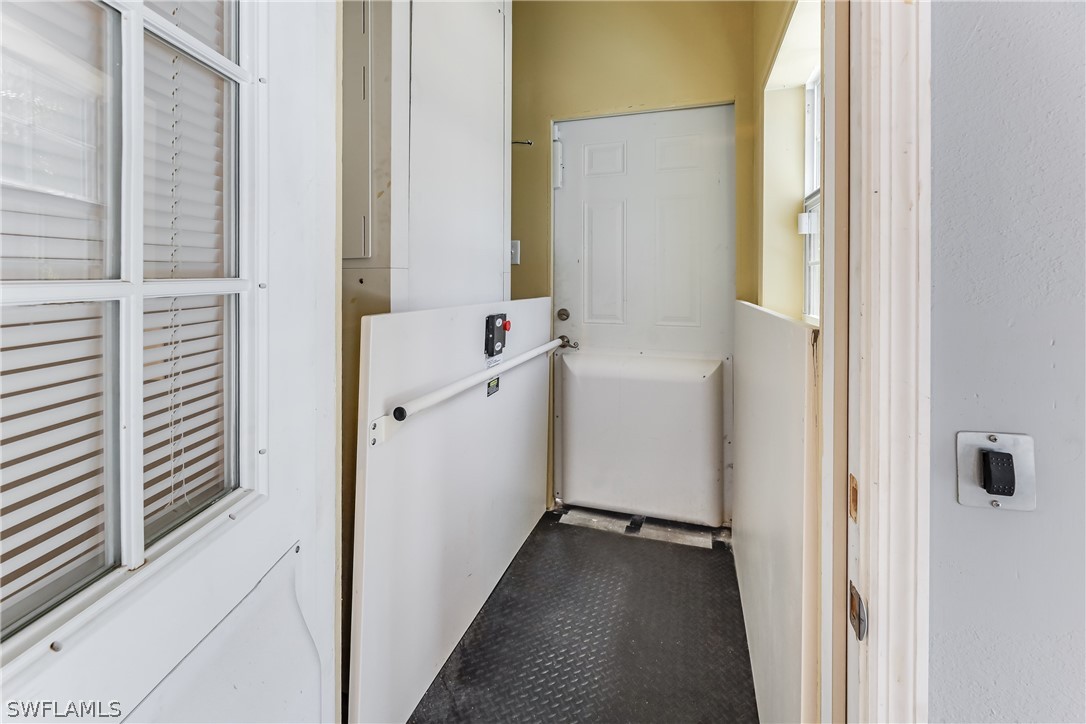 2885 Triggerfish Street Cape Coral, FL 33993 - Photo 22 of 35 a view of a hallway with wooden floor and closet