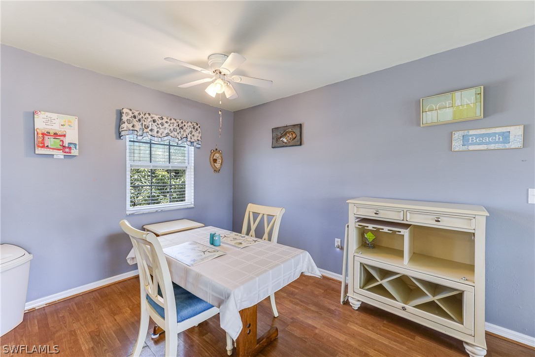 2885 Triggerfish Street Cape Coral, FL 33993 - Photo 24 of 35 a view of a dining room with a table and chairs