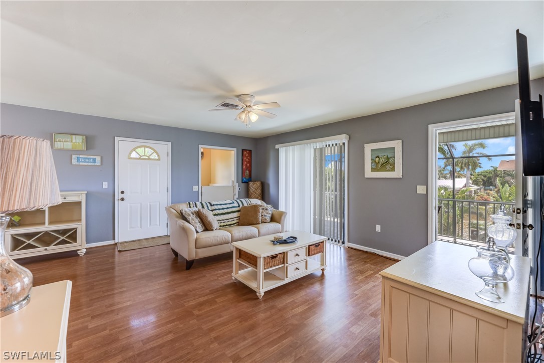 2885 Triggerfish Street Cape Coral, FL 33993 - Photo 28 of 35 a living room with furniture and a flat screen tv