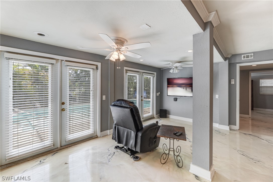 2885 Triggerfish Street Cape Coral, FL 33993 - Photo 10 of 35 a view of a livingroom with furniture and windows
