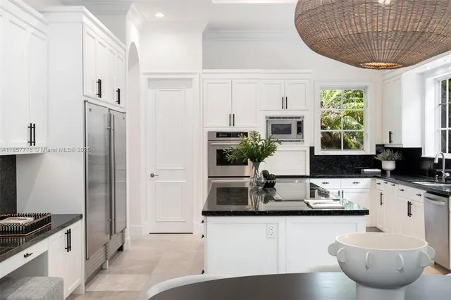 a living room with furniture a rug and a flat screen tv
