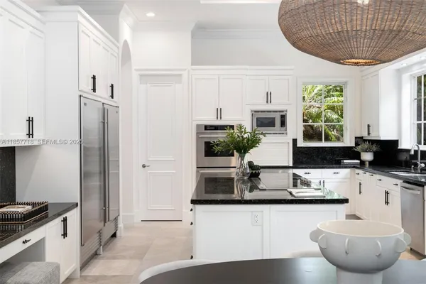 a living room with furniture a rug and a flat screen tv