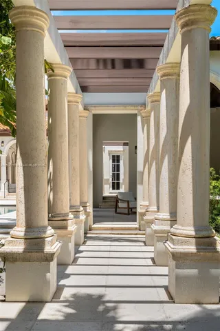 a view of a house with swimming pool and sitting area