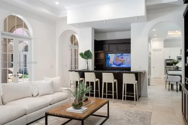 a living room with furniture and windows