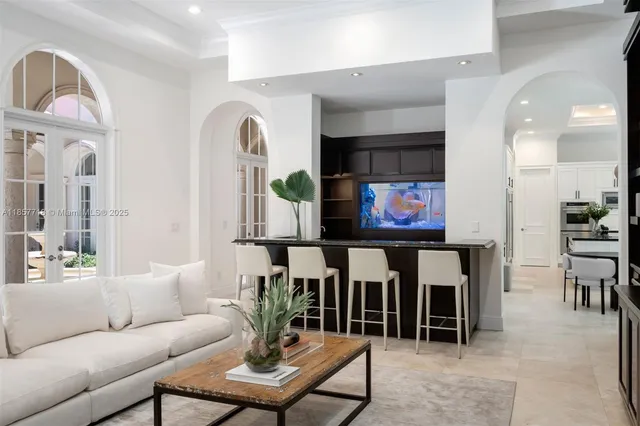 a living room with furniture and windows