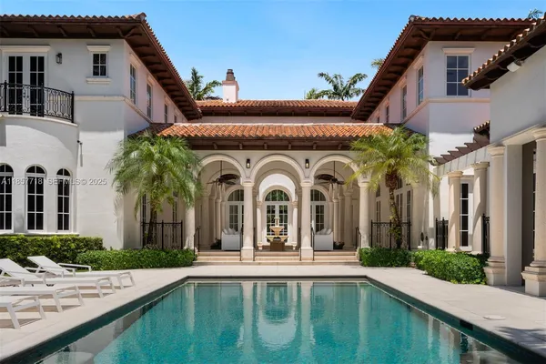 a view of staircase and hallway with windows
