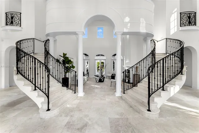 a vase of flowers sitting next to a window