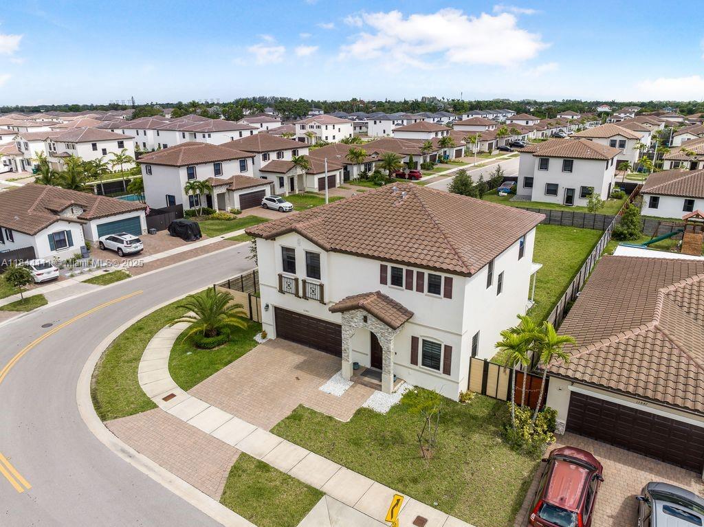 an aerial view of a house with a garden