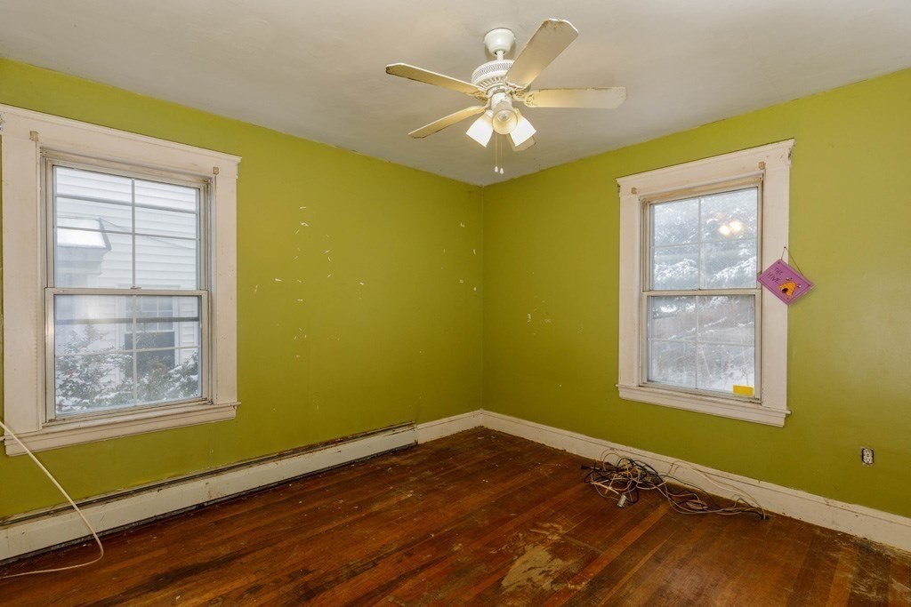 4 Capitol Street Methuen, MA 01844 - Photo 7 of 12 a view of an empty room with a window and wooden floor