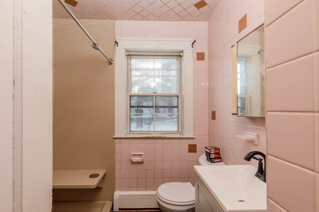 4 Capitol Street Methuen, MA 01844 - Photo 8 of 12 a bathroom with a sink a toilet and shower