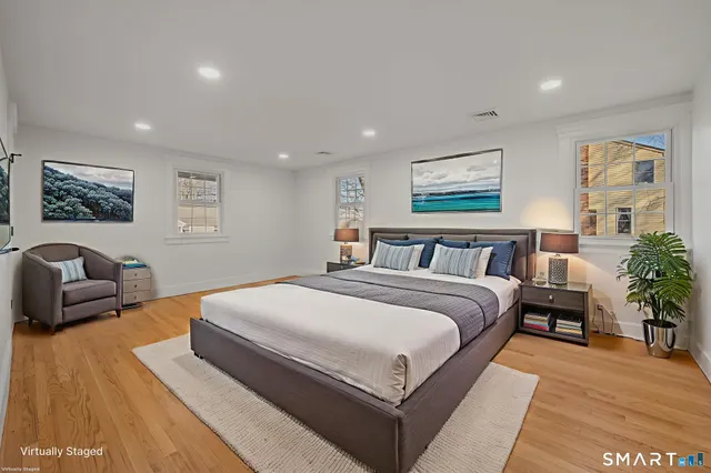 a spacious bedroom with a large bed and a couch