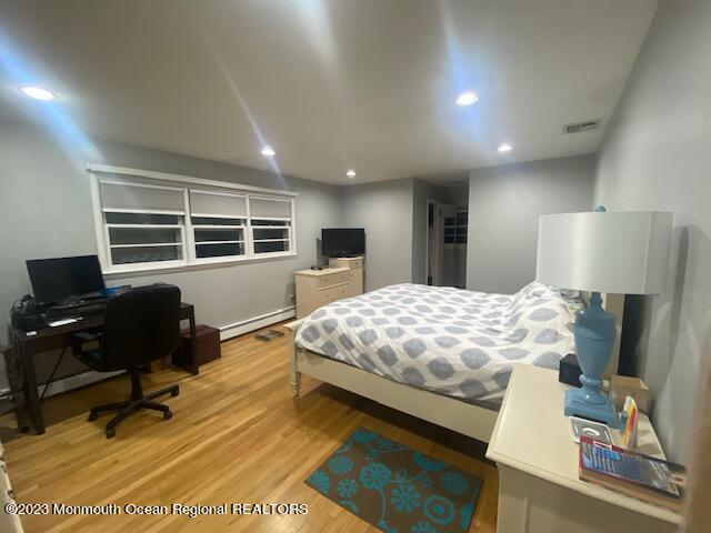 293 Lawrence Avenue Oakhurst, NJ 07755 - Photo 13 of 18 a bedroom with a large bed and a window