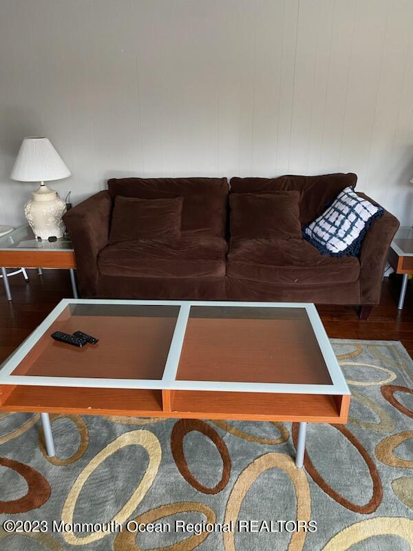 293 Lawrence Avenue Oakhurst, NJ 07755 - Photo 16 of 18 a living room with a couch and a coffee table