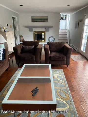 a living room with furniture and a rug