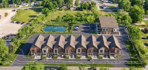 an aerial view of residential house with outdoor space and swimming pool