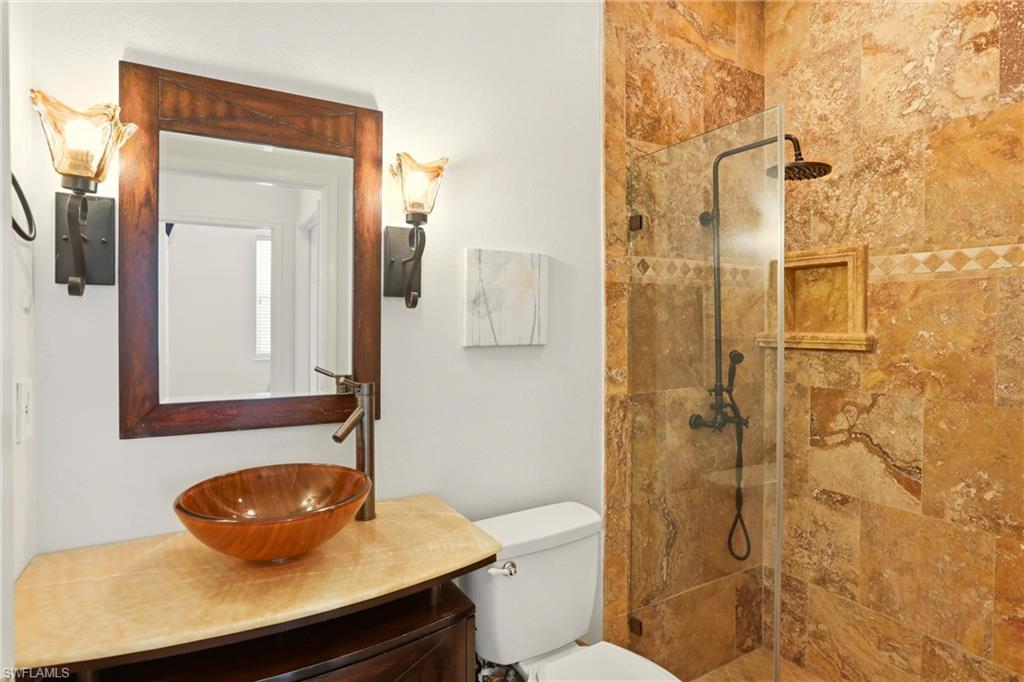 2150 Khasia Point Naples, FL 34119 - Photo 14 of 39 Bathroom featuring a walk in shower and vanity