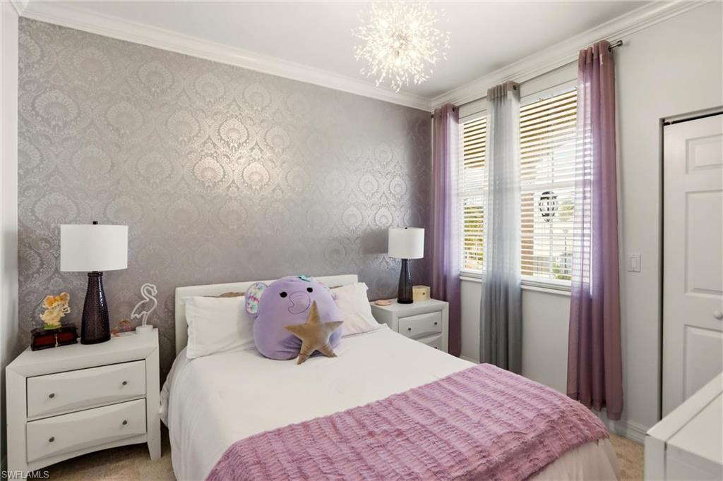 2150 Khasia Point Naples, FL 34119 - Photo 16 of 39 Bedroom with wallpapered walls, crown molding, and a chandelier