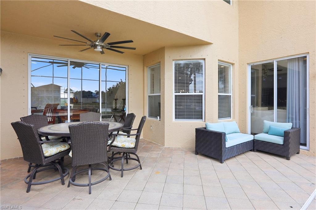 2150 Khasia Point Naples, FL 34119 - Photo 19 of 39 View of patio / terrace featuring ceiling fan and outdoor dining space