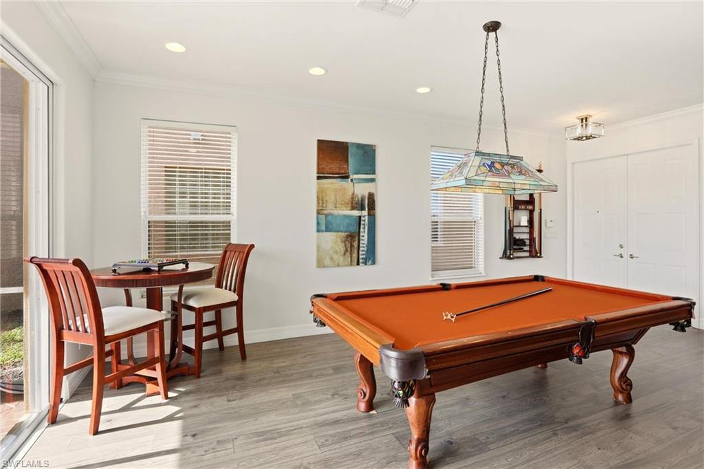 2150 Khasia Point Naples, FL 34119 - Photo 32 of 39 Rec room with billiards, wood finished floors, ornamental molding, and recessed lighting