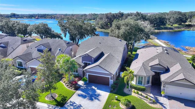 an aerial view of a swimming pool patio and outdoor seating