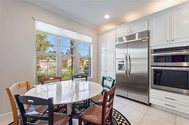 a spacious bedroom with a bed and a painting on the wall