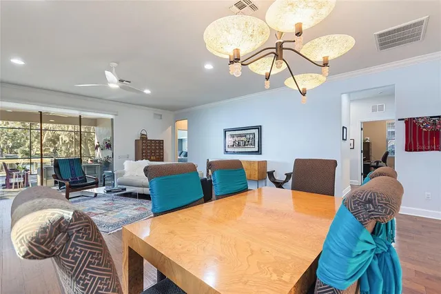 a table room with furniture and a wooden floor