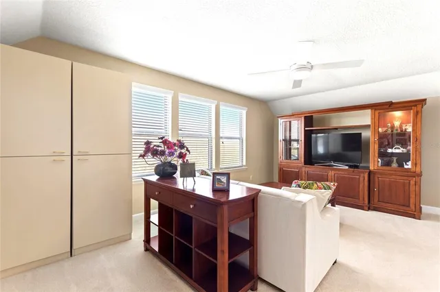 a large room with lots of furniture and a chandelier