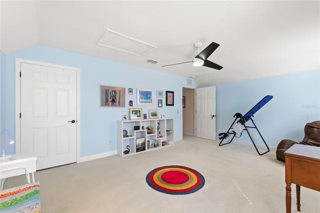 a room with lots of wooden furniture and stainless steel appliances