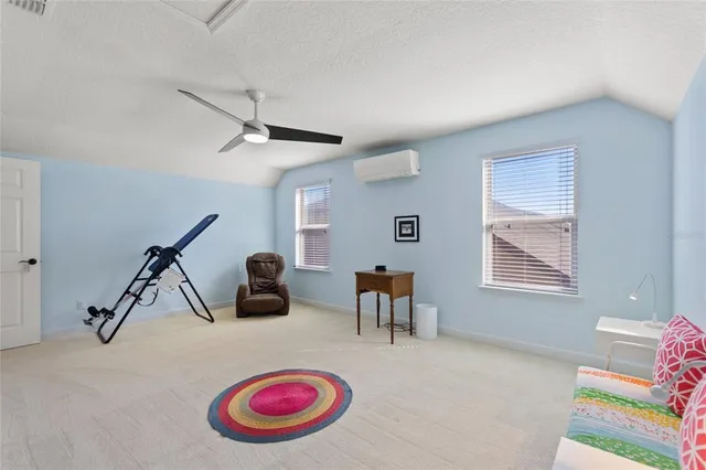 an aerial view of residential houses with outdoor space and river