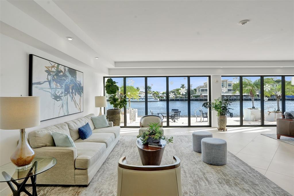 5100 Dupont Boulevard, Unit 3G Fort Lauderdale, FL 33308 - Photo 23 of 46 a living room with furniture and a floor to ceiling window