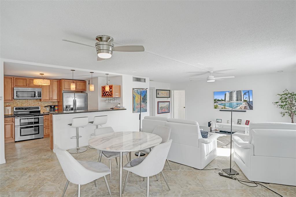 5100 Dupont Boulevard, Unit 3G Fort Lauderdale, FL 33308 - Photo 3 of 46 a living room with furniture and kitchen view