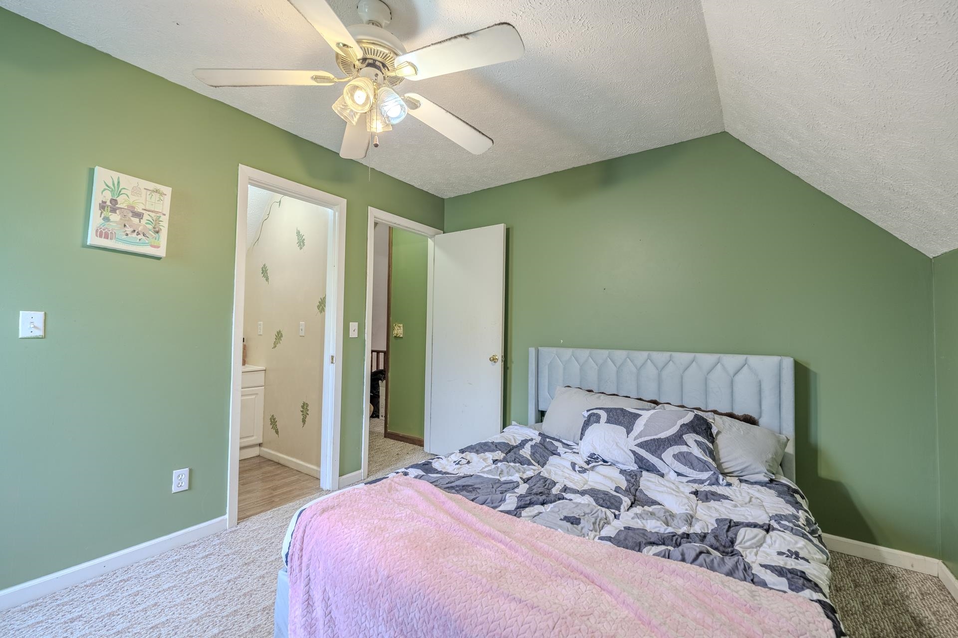 635 Pompeys Branch Road Savannah, TN 38372 - Photo 12 of 26 Carpeted bedroom featuring a ceiling fan and ensuite bathroom