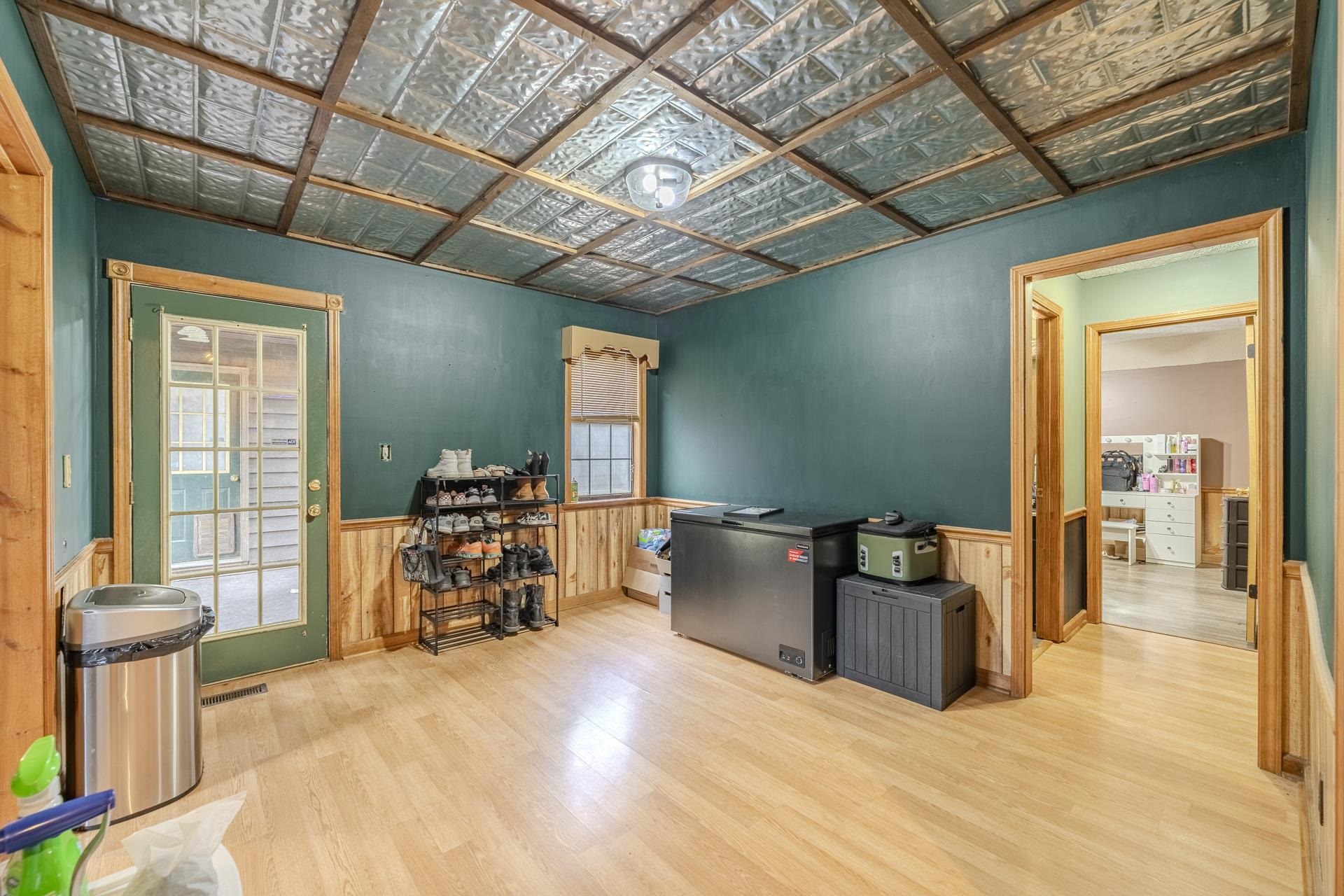 635 Pompeys Branch Road Savannah, TN 38372 - Photo 17 of 26 Office space with an ornate ceiling, light wood-style floors, wainscoting, and wooden walls