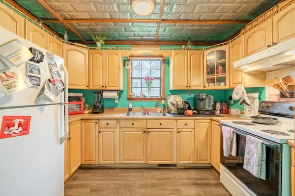a kitchen with stainless steel appliances granite countertop a stove and a sink