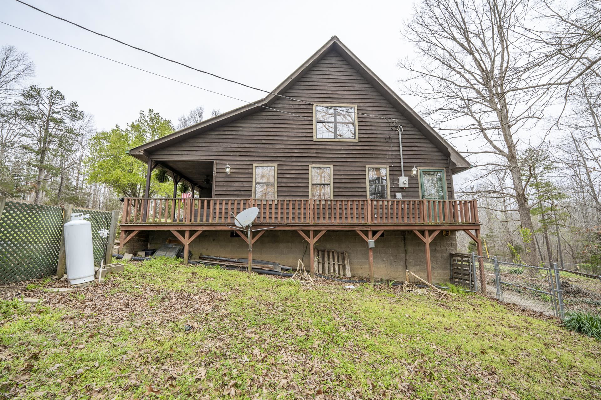 635 Pompeys Branch Road Savannah, TN 38372 - Photo 4 of 26 Rear view of house featuring a gate and a wooden deck