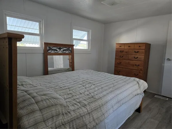 a bedroom with a bed and furniture