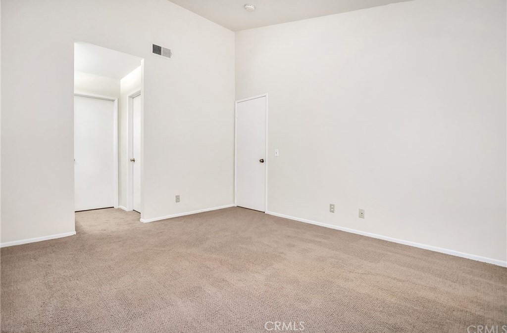 341 Stanford Court, Unit 26 Irvine, CA 92612 - Photo 11 of 24 an empty room with an entryway